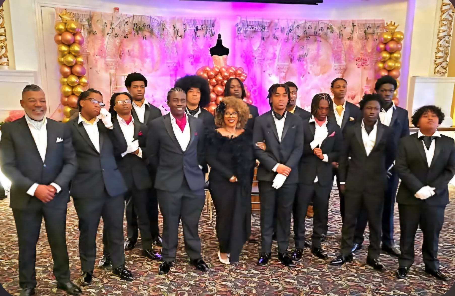 Sabrina Martinez with MEG students formally dressed at the Rites of Passage cotillion